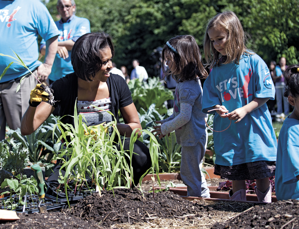 First Lady Michelle Obama participates in a Garden Harvest Event with children and members of the American Indian community in the White House Kitchen Garden on the South Lawn of the White House, June 3, 2011. (Official White House Photo by Samantha Appleton)