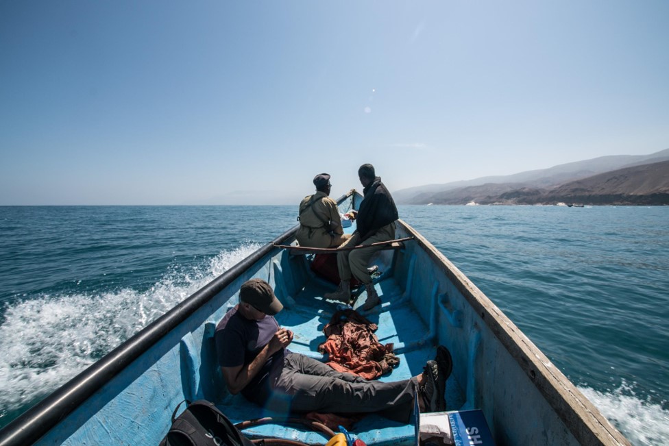 As we travel down a dangerous section of the Puntland shoreline in Somalia, guards tell me to sit on the floor to be less visible from shore. Photo: Fabio Nascimento, The Outlaw Ocean