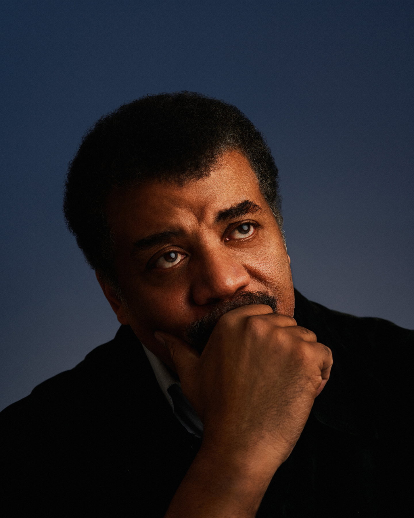 A photo of Neil deGrasse Tyson looking ponderous.