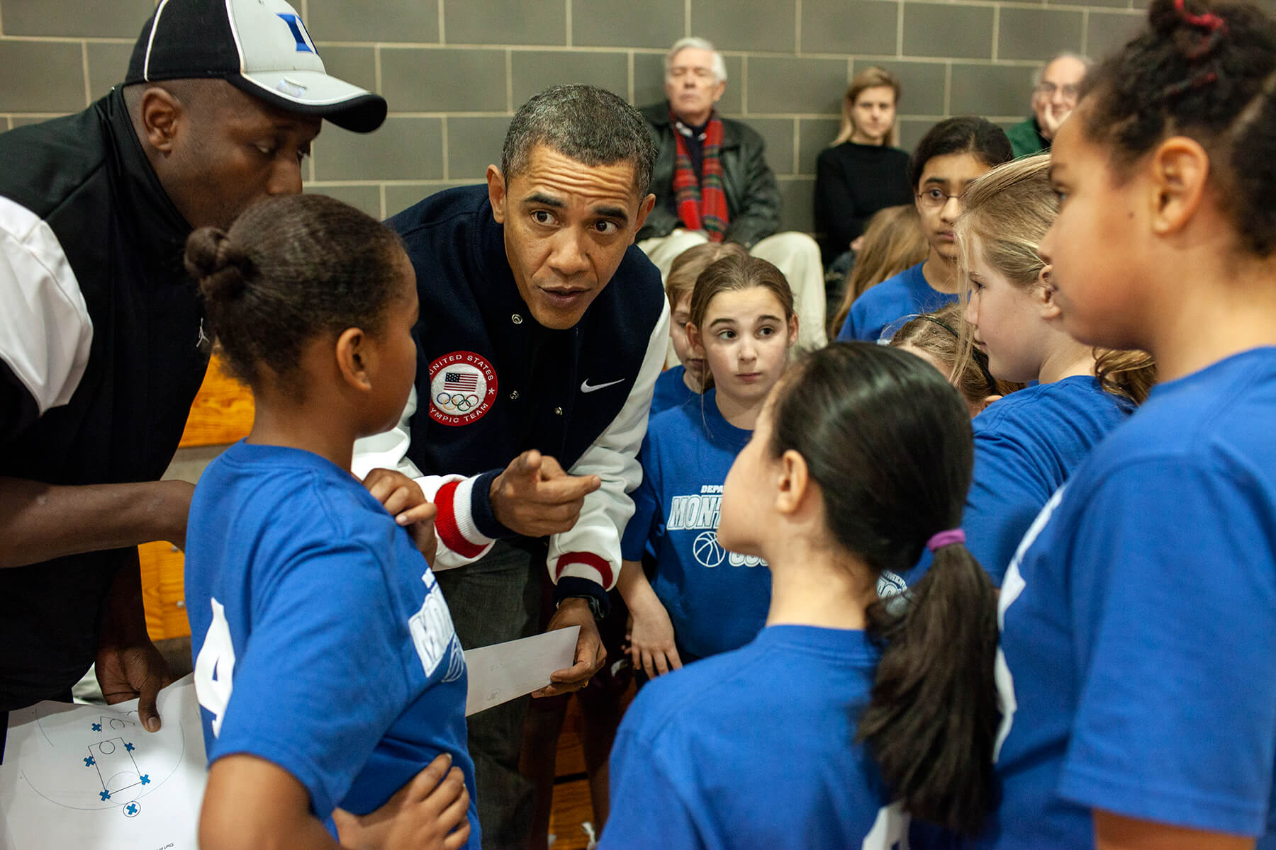  President Barack Obama coaches Sasha’s basketball team with help from personal aide Reggie Love in Chevy Chase, MD, February 5, 2011. 