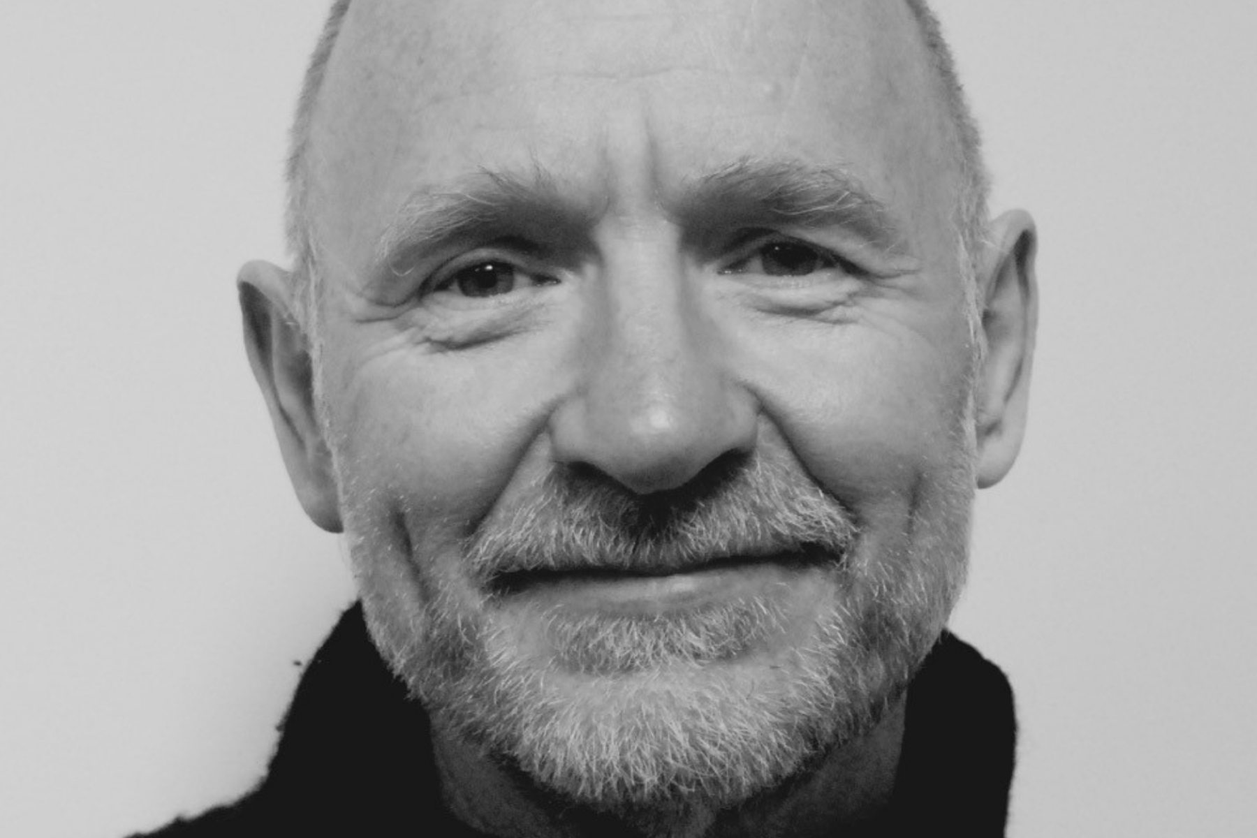 A photo of Scottish author and poet James Robertson, close up, in grayscale