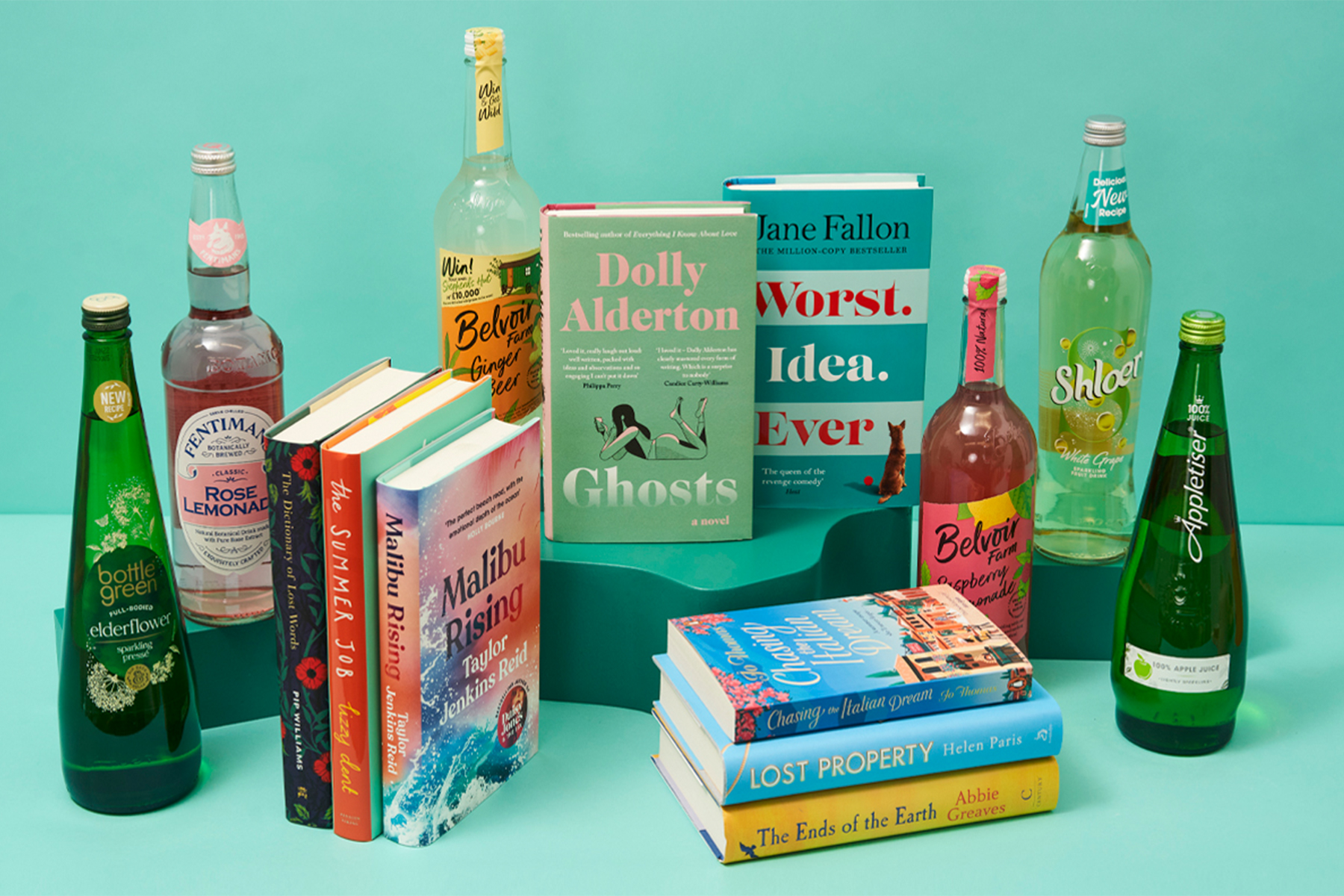 A photograph of eight books and six bottles of spritzes, arranged against a turquoise background.