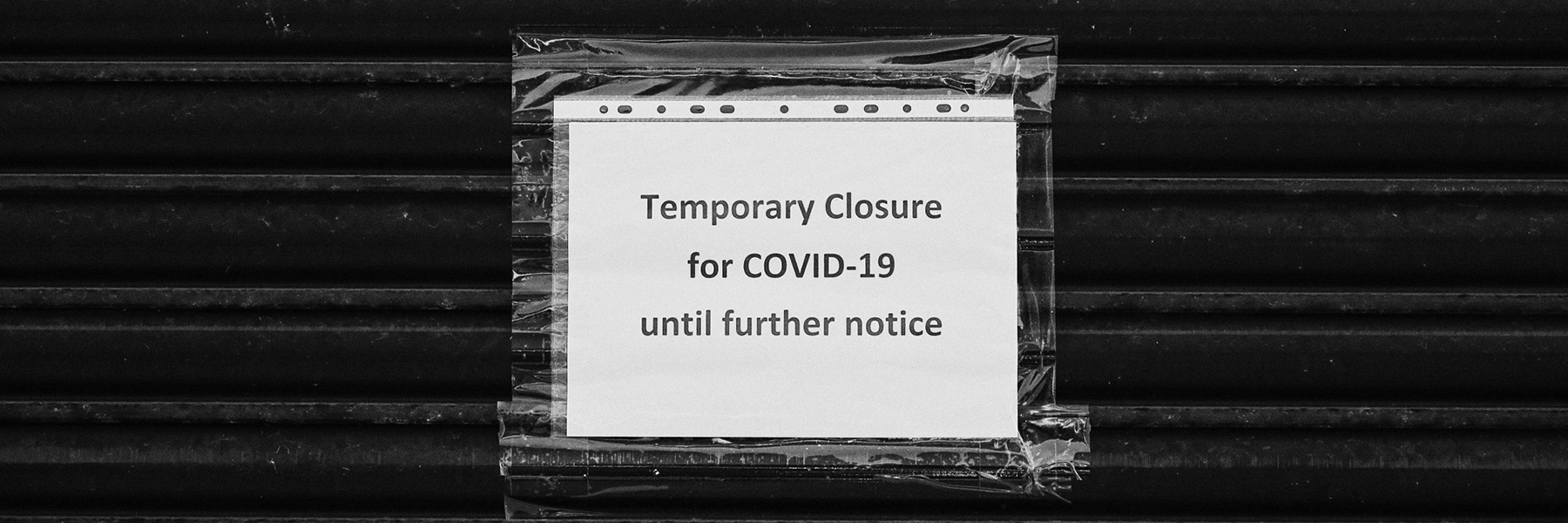 A sign indicating the closure of a building mid-pandemic. Image: Getty