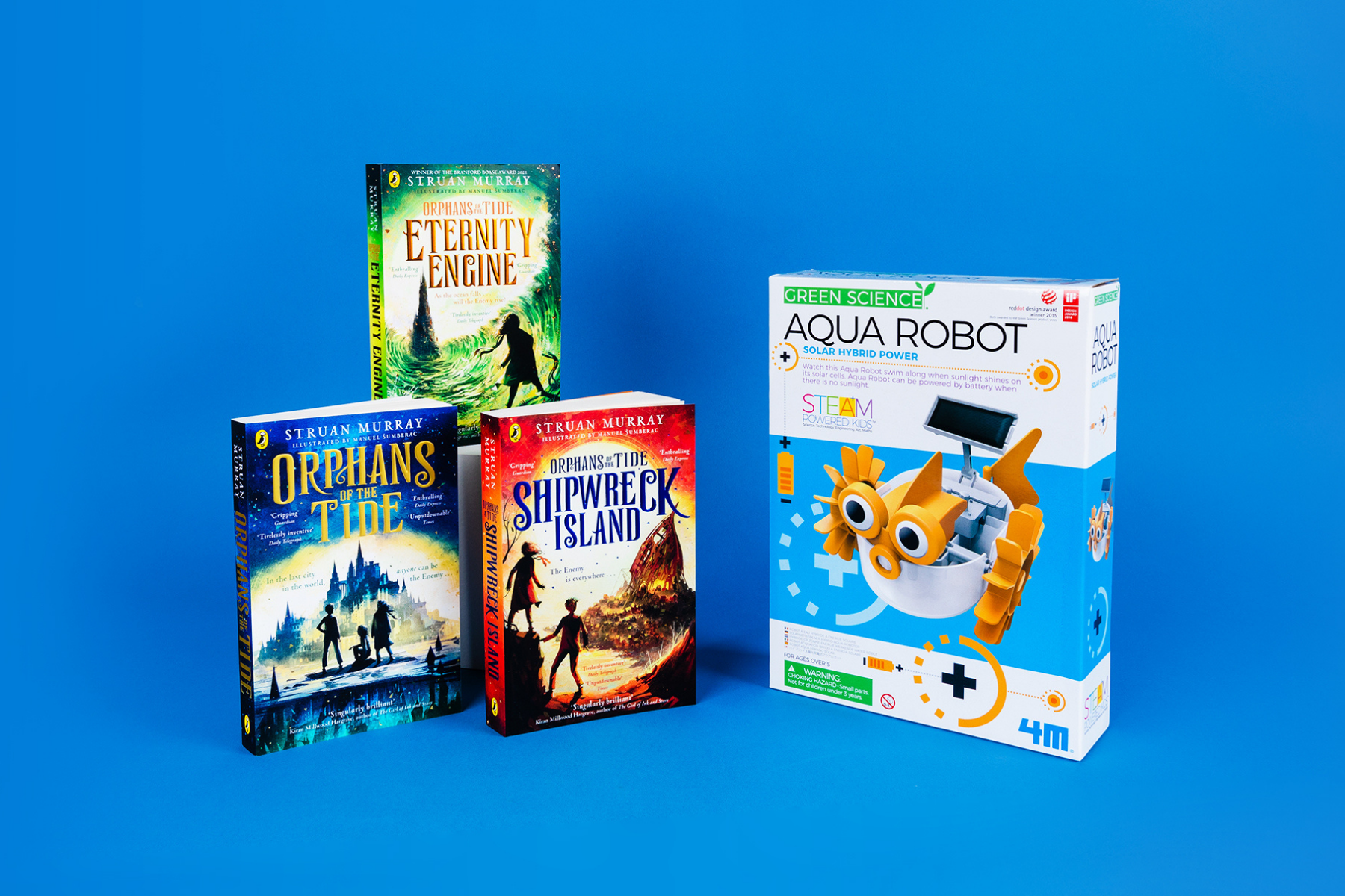 gggA photo of the three books in the Orphans of the Tide series next to an invention kit against a blue background